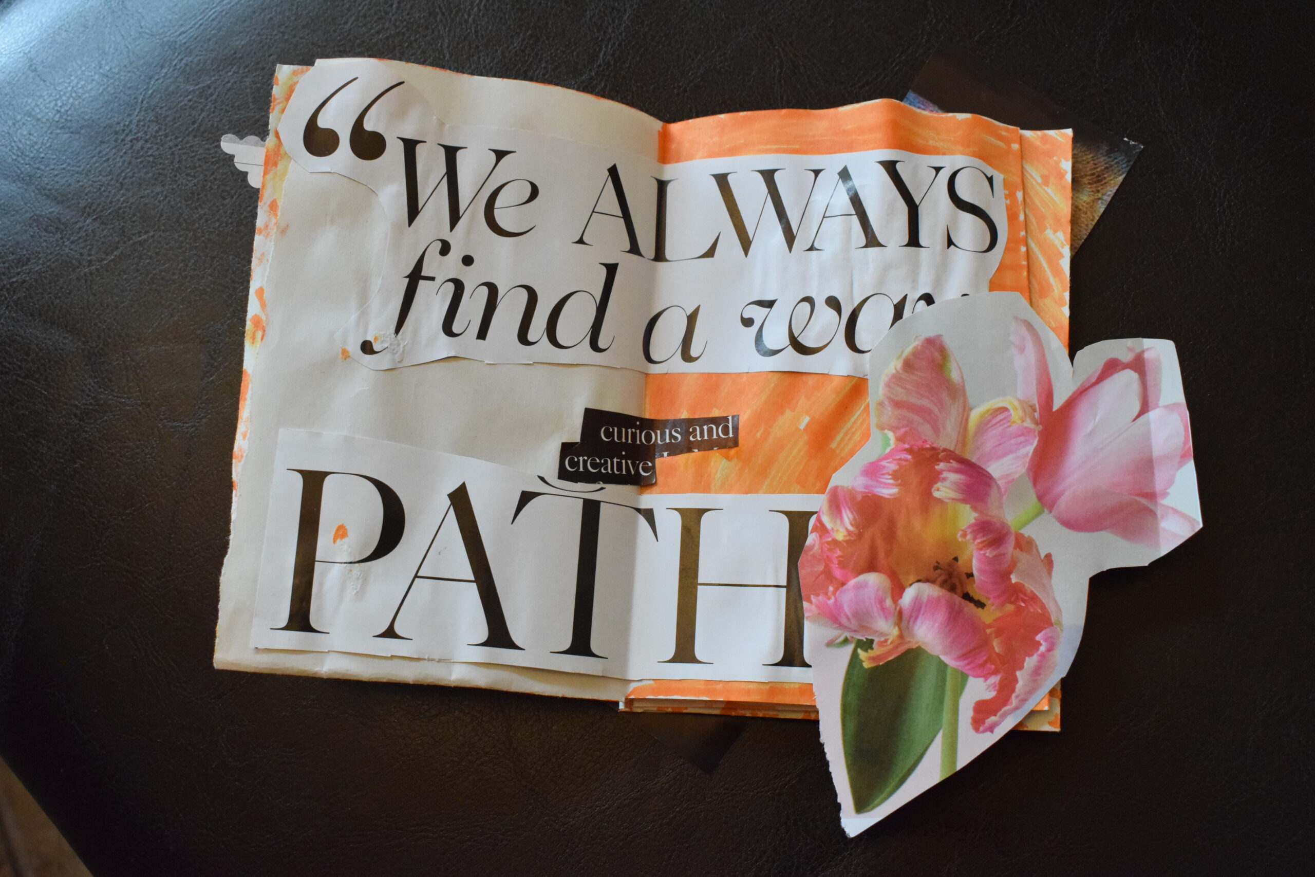 collage of paper that reads 'we will allways find a way, curious and creative path' with a cut out image of pink tulips