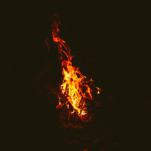 A plume of fire against a black background